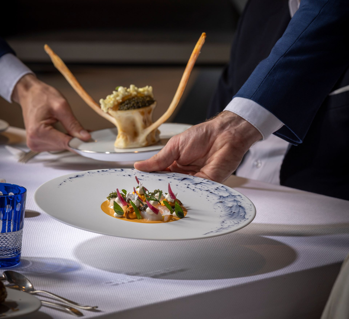 A plate of food with a spoon sticking out of it