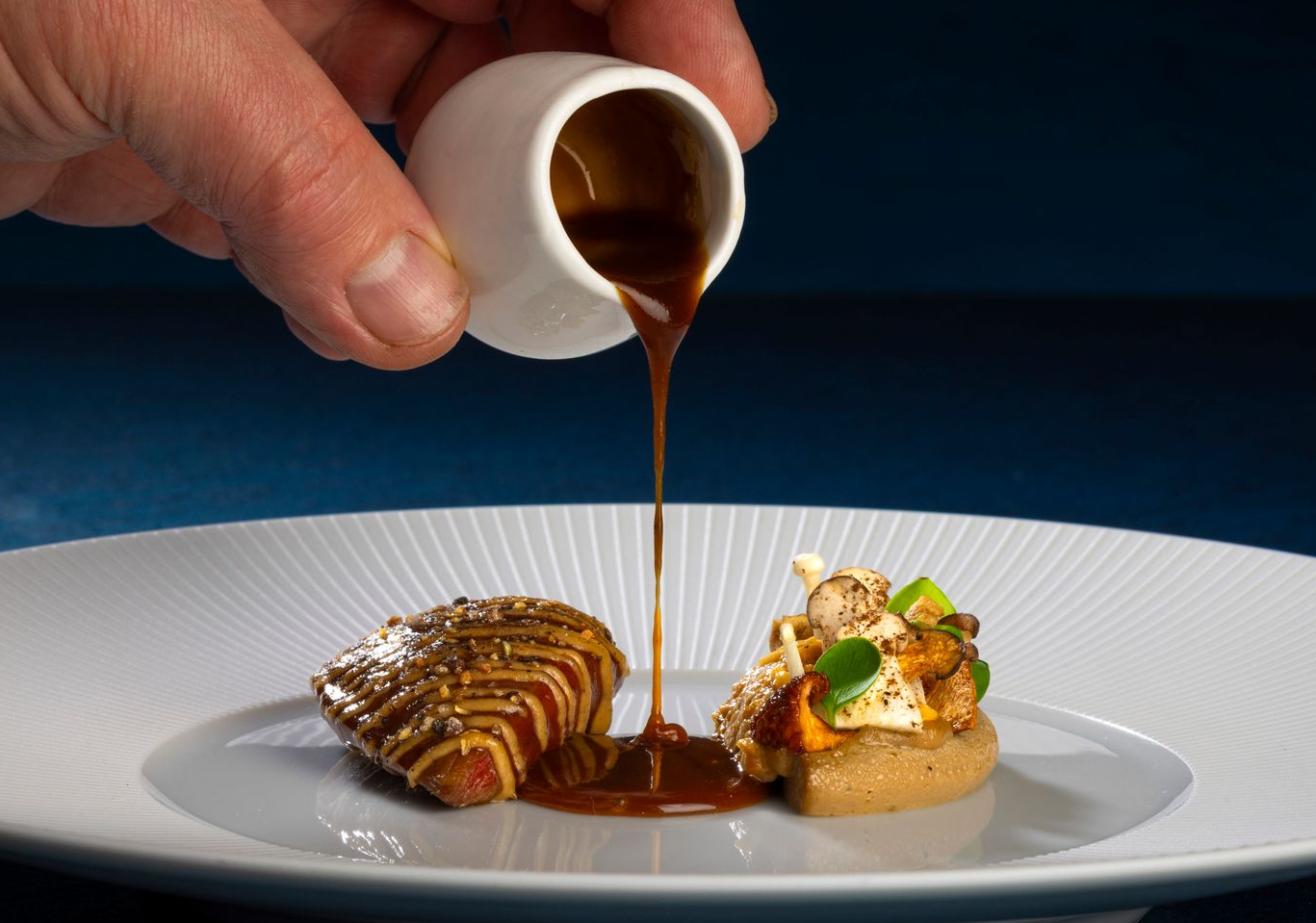 A plate of food with a spoon sticking out of it