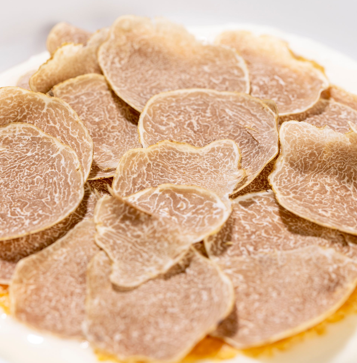 A plate of food with a spoon sticking out of it
