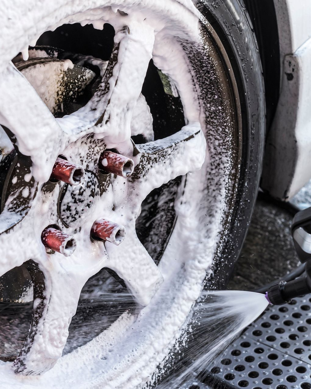 A close up of water drops on the hood of a car