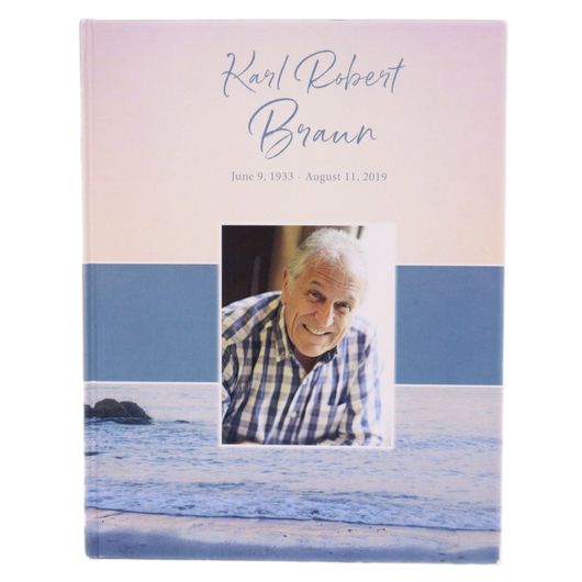 Kahl Robert Braun memorial card with smiling portrait over a beach sunset background