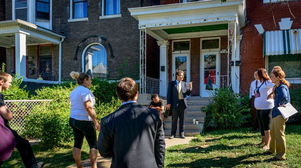 Thomas Harvey, then one of the attorneys with ArchCity Defenders, a non-profit civil rights, holistic law firm in St. Louis, that provides legal assistance to clients in need but unable to retain legal help otherwise, briefs the other lawyers, social workers, neighbors, and allies about what they are doing for the tenant and the possible steps that need to be taken to help the family either stay in this home, or find a suitable alternative. Photographed on August 4, 2017.