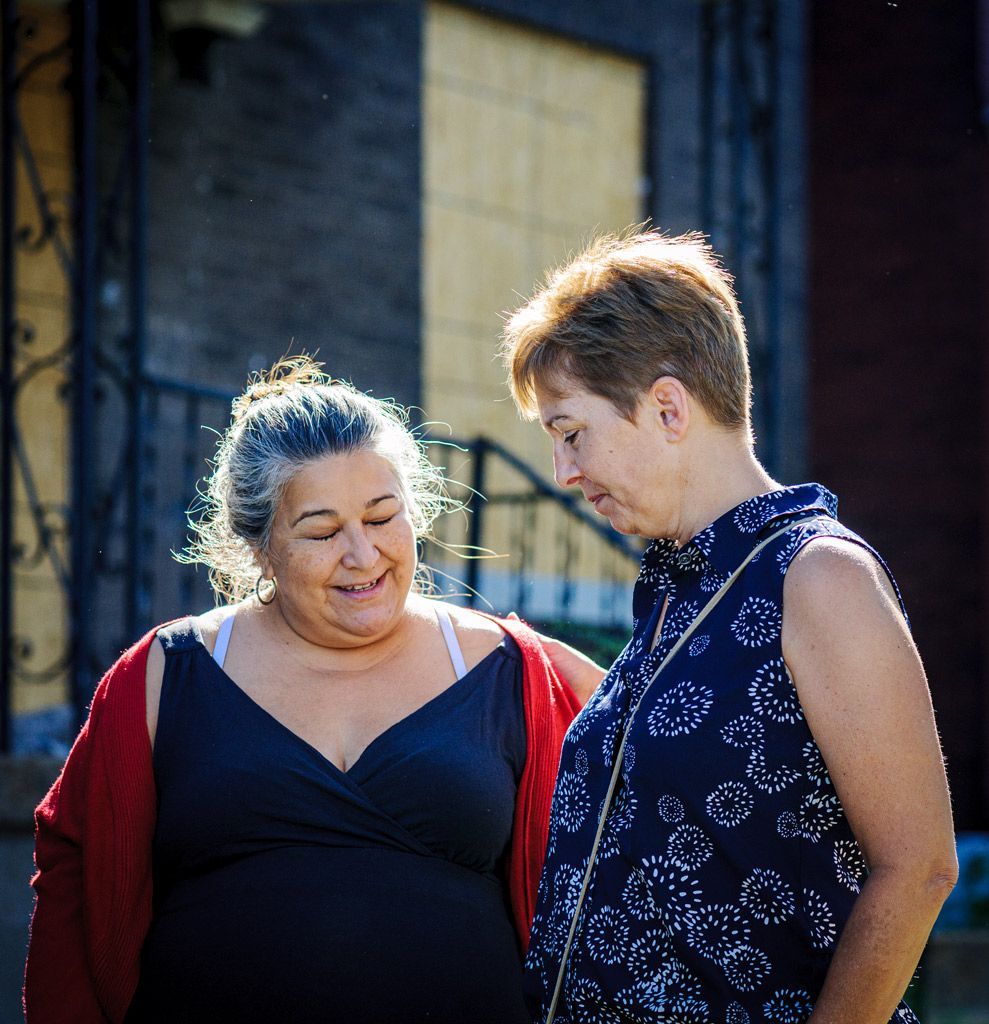 Two activist allies who rushed to the scene to be available to help the family if evicted on that day stand off to the side waiting. This type of support is not unusual in the activist community, and are often referred to as “family.” Photographed on August 4, 2017.