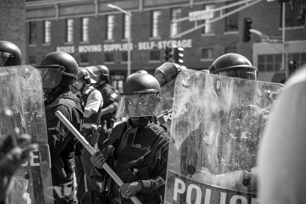 This police line was ordered to contain the Stockley protesters in downtown St. Louis. The young female officer’s concern is vividly apparent in her expression. Later that day, the police employed a tactic termed “kettling” where protesters are surrounded without a way to move away, then commanded to leave causing chaos, and then the opportunity for the police to arrest them for not obeying the order to disband. Photographed on September 15, 2017. 