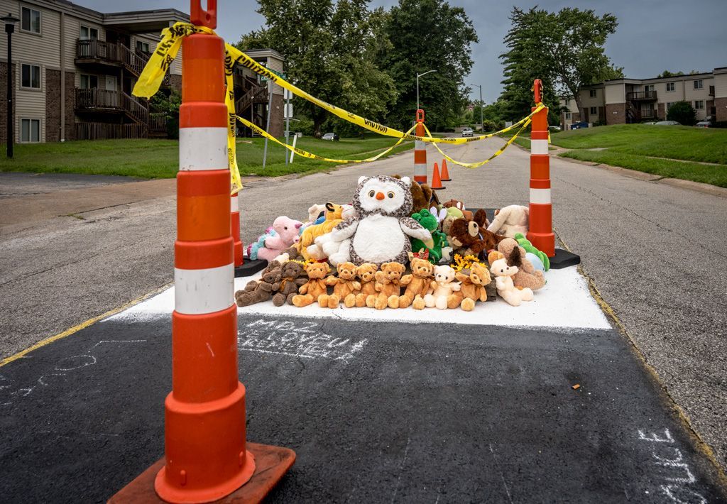 Scene from the 9th anniversary memorial for Michael Brown, Jr. prior to the event. Mourners prepare the site of his death each year with stuffed animals to emphasize that this was an unarmed teenager who was gunned down for no other discernible reason that he had jaywalked across the street. Photographed August 9, 2023.