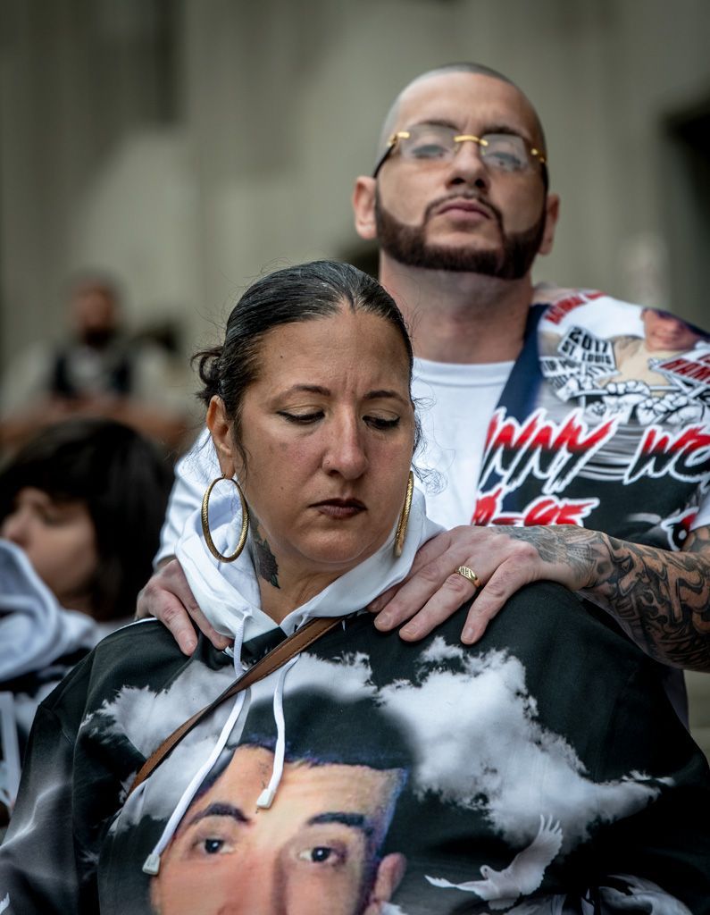 The parents of Isaiah Hammett at a memorial vigil outside the St. Louis Circuit Courts as they await a hearing into the death of their son by a SWAT team. Without a search warrant, the team entered the house where Isaiah was caring for his sick grandfather on June 7, 2017. Within minutes Isaiah was dead. The police report justified the shooting, but was later debunked. At this vigil, the family displayed morgue photos of the body, further debunking police claims about what happened during their raid on the home. Photographed September 20, 2023.