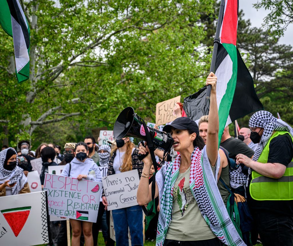An activist leads chants with a group who gathered to protest for a free Palestinian state. Chants are often used to state the common demands and goals of a protest, as well as to display the solidarity of those participating in a demonstration. Photographed April 27, 2024.