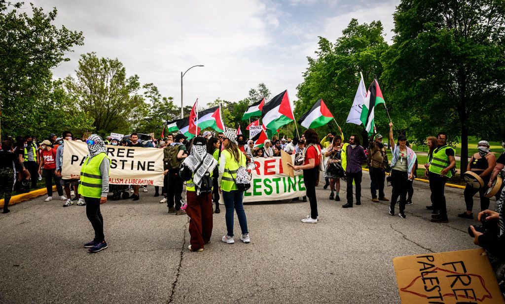 Protesters assemble in Forest Park to march to the Washington University in St. Louis campus nearby. They were demonstrating the continue genocide, land grabs, and war crimes committed by the State of Israel. Photographed April 27, 2024.