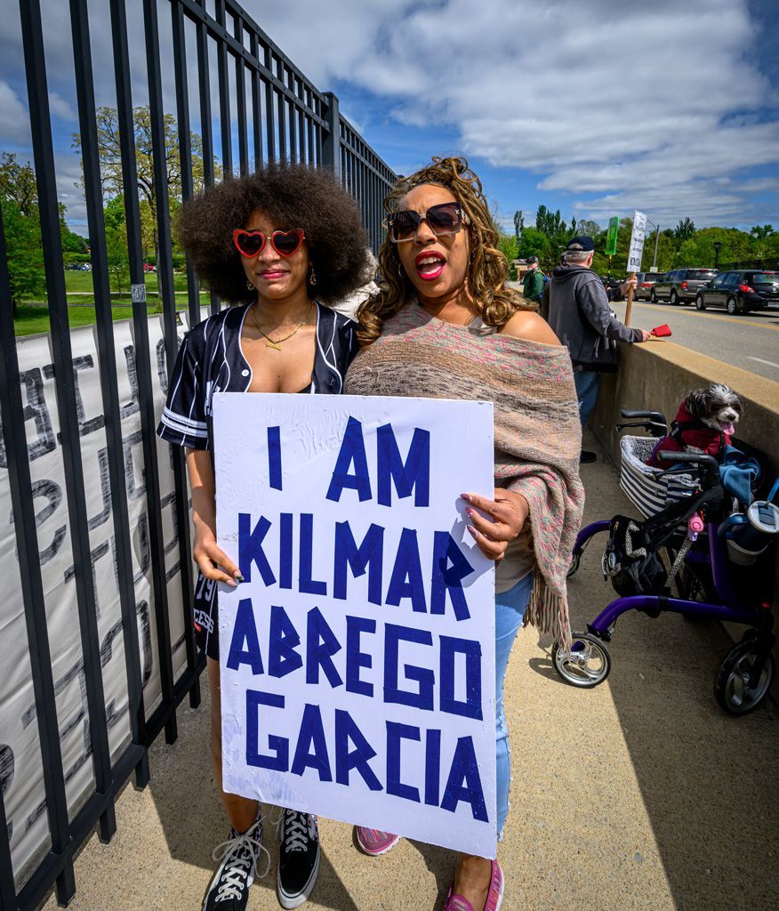 Two young ladies protest in the Bring Kilmar Abrego Garcia Home protest in St. Louis, Missouri, where the message was to stop the abuse of power by the Trump administration and Homeland Security’s ICE to wrongfully enforce immigration laws by kidnapping, detaining, abusing, and deporting legal immigrants and naturalized citizens without due process. The protest was held on the Tamm Avenue and I-64 overpass in the Dogtown neighborhood. Photographed on April 26, 2025.
