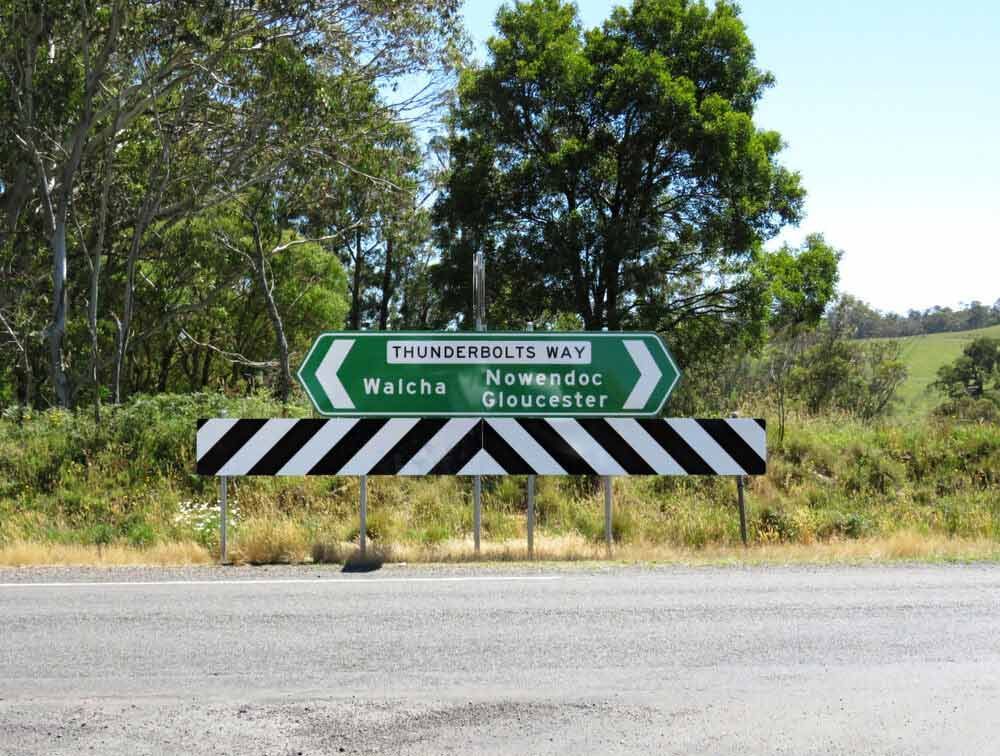 A Sign On The Side Of A Road That Says Thunderbolts Way — Mid Coast Boundary Fencing In Gloucester, NSW