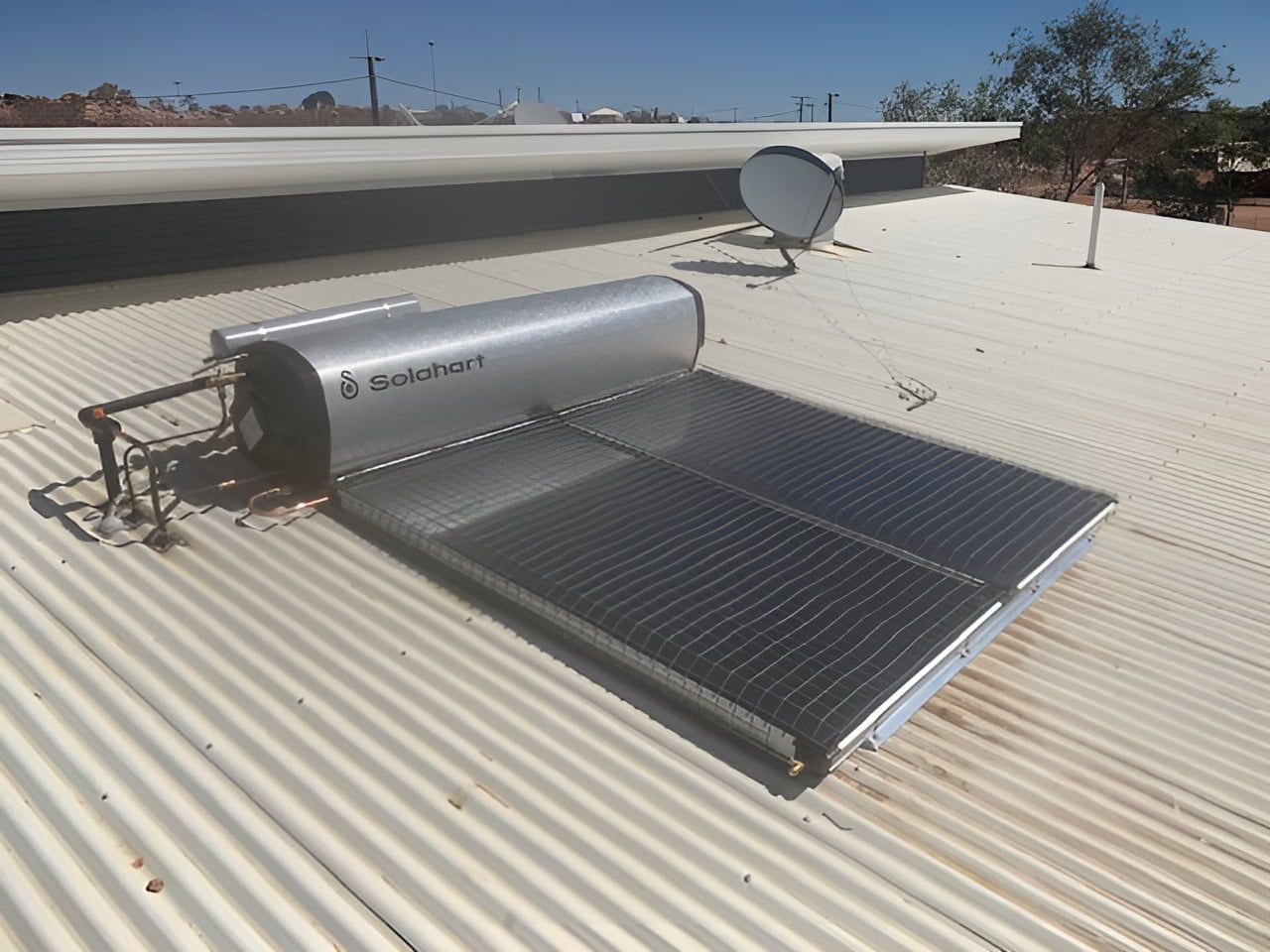 A Solar Water Heater Is On The Roof Of A Building — Araluen Plumbing In Braitling, NT