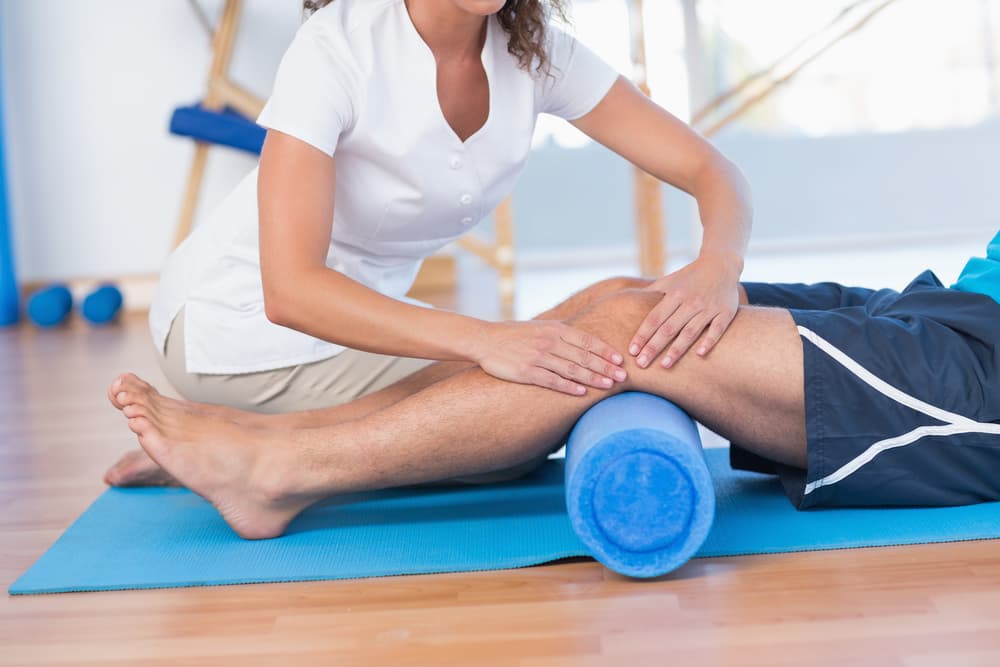 Physiotherapist Working on Man's Knee — Physiotherapist in Bundaberg, QLD