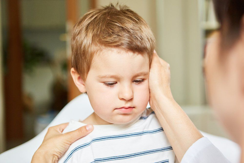Child Undergoing Physiotherapy For Shoulder Pain — Physiotherapist in Bundaberg, QLD