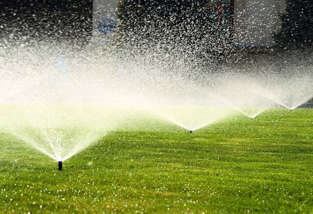 Garden Sprinkler on The Green Lawn — Dayton, TX — Precision Lawns
