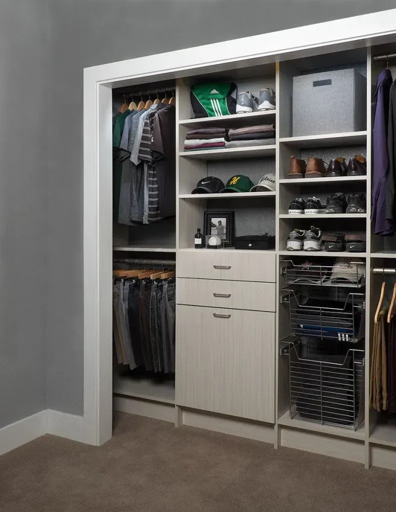 A walk in closet filled with clothes and shoes