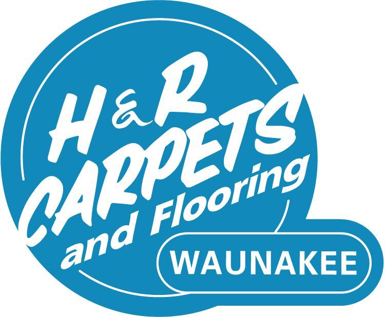 Logo for H&R Carpets and Flooring in Waunakee. Blue circle with white text.