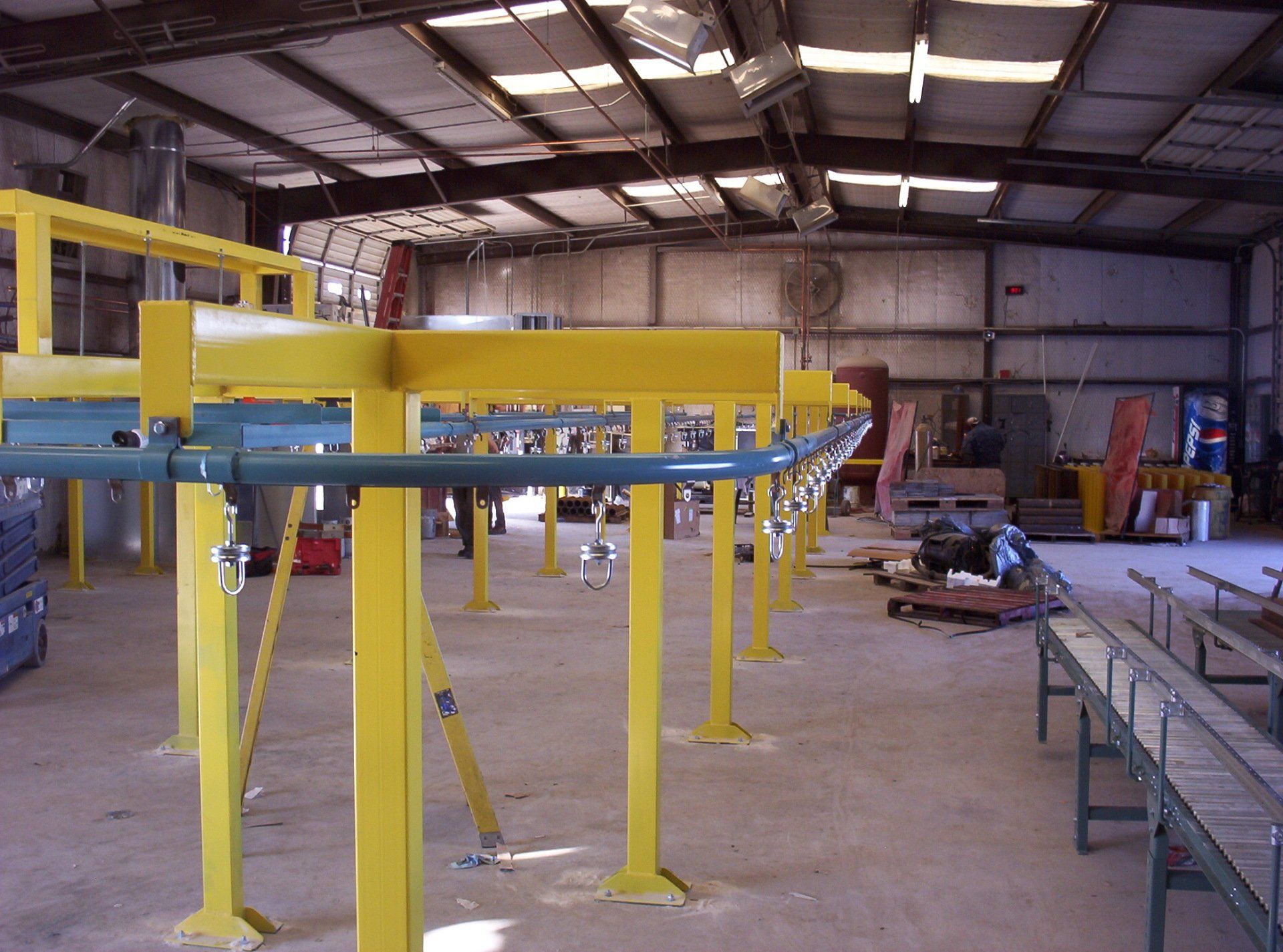 Industrial Conveyors — Blue and Yellow Colored Conveyors in Cedar Rapids, IA