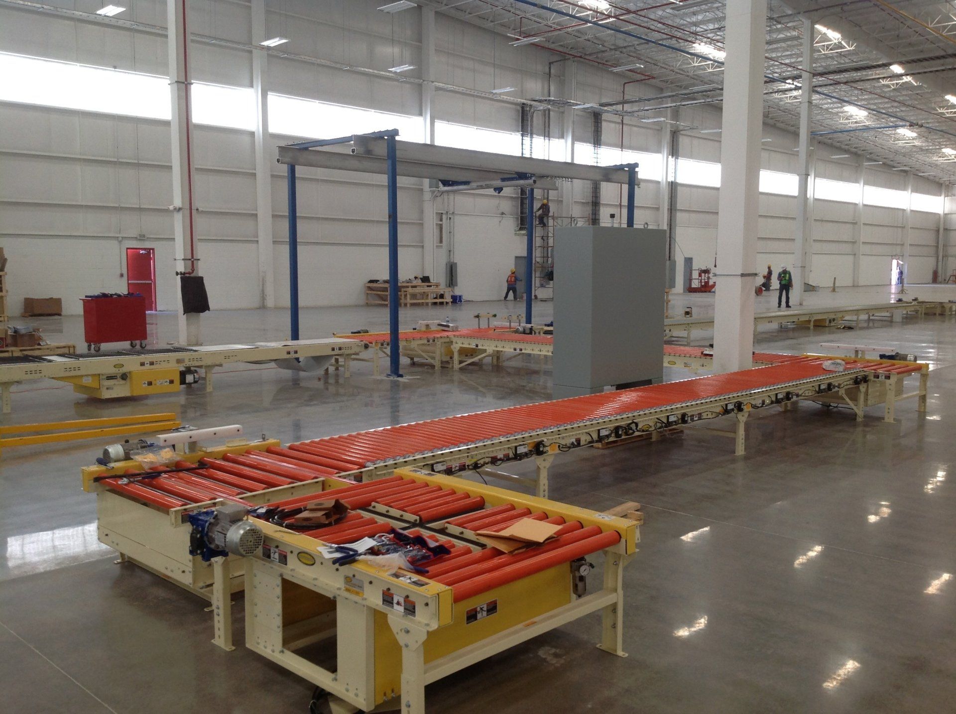 Custom Conveyors — Orange Rollers in Cedar Rapids, IA