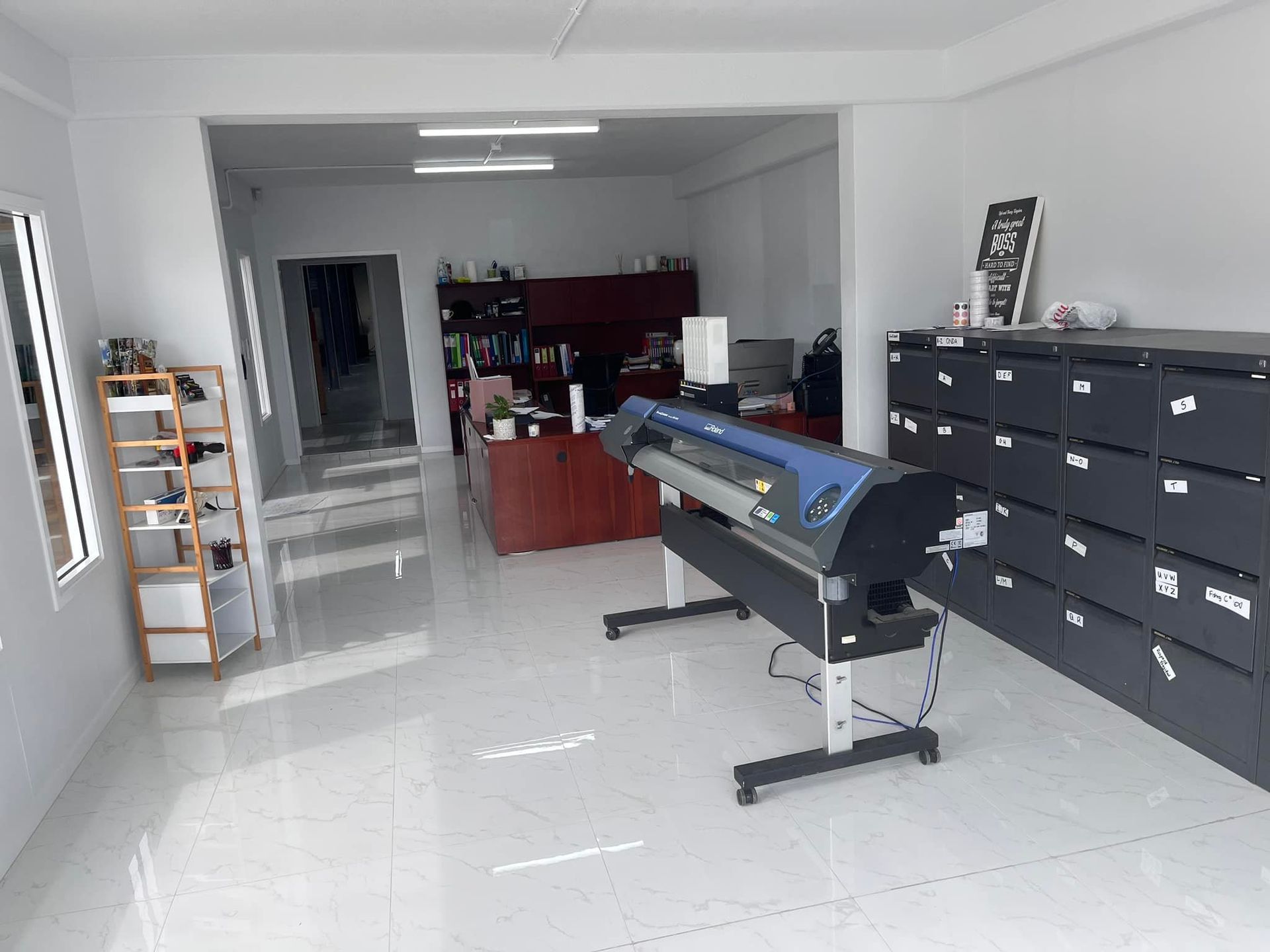 A Large Printer is Sitting in the Middle of a Room — Aldine Printers in Atherton, QLD