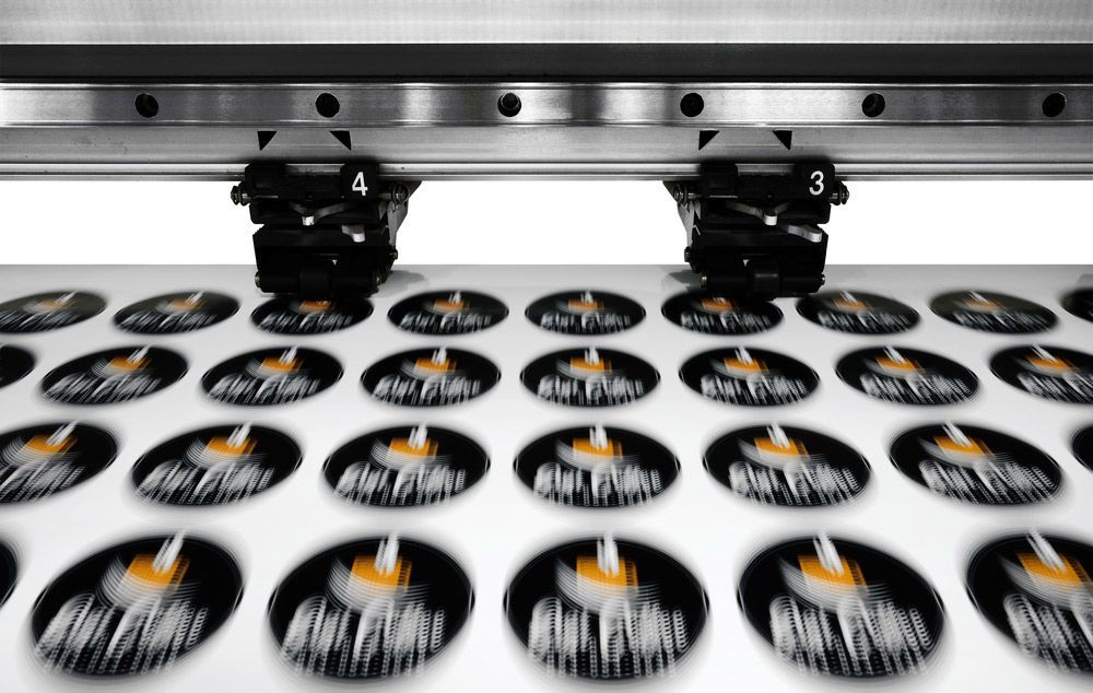 A Bunch of Stickers are Being Printed on a Machine — Aldine Printers in Mareeba, QLD