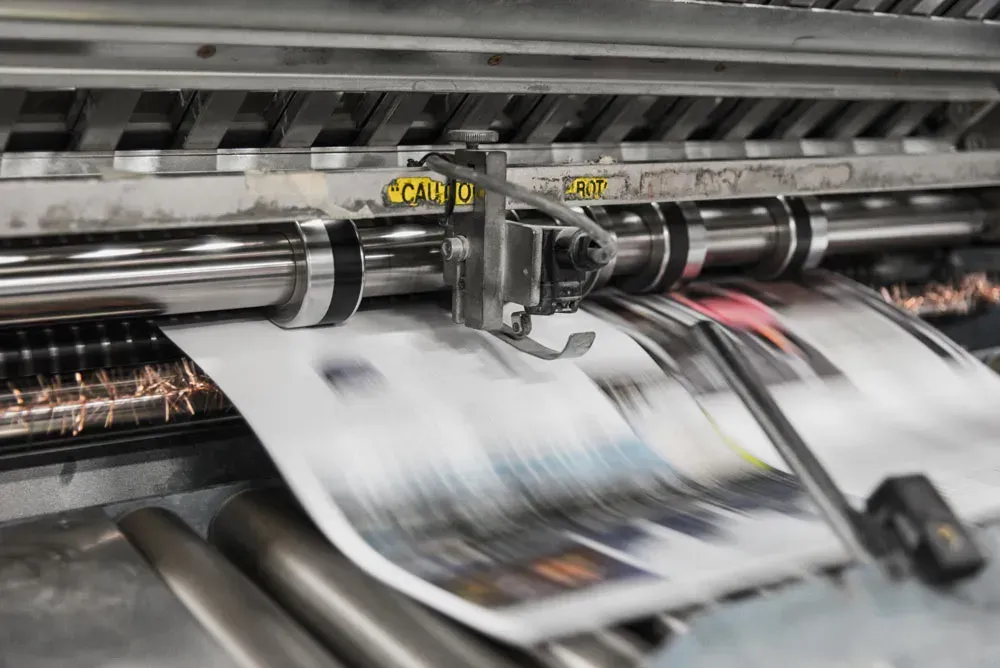 A Newspaper is Being Printed on a Printing Machine — Aldine Printers in Bungalow, QLD