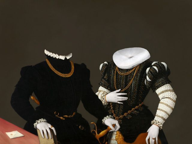 Two mannequins in Tudor-era clothing, lacking heads, set against a dark background.