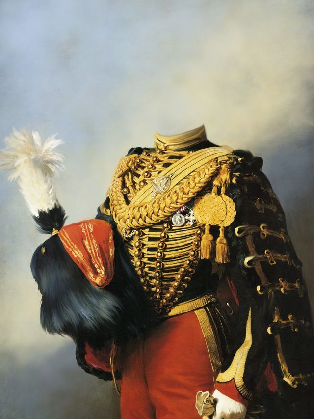 Formal military uniform with gold trim, red pants, holding a feathered hat.