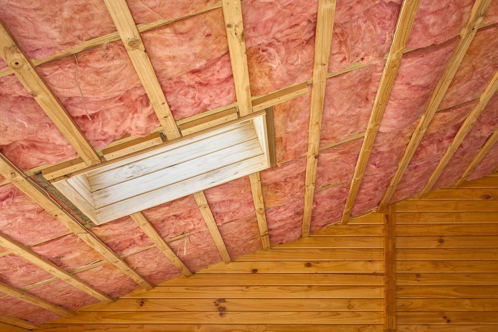 A Ceiling With Pink Insulation and a Light on It — Ben McLennan Constructions in Grafton, NSW