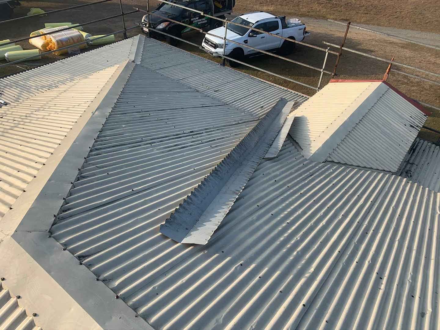 A White Truck is Parked on the Roof of a Building — Ben McLennan Constructions in Grafton, NSW