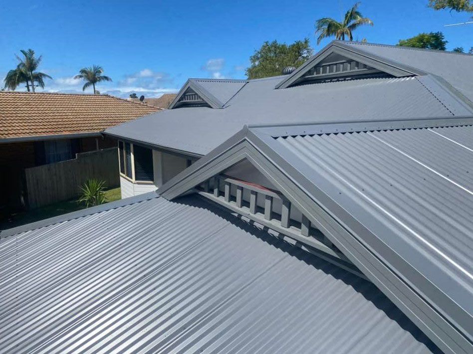 A House With a Gray Roof and a Blue Sky in the Background — Ben McLennan Constructions in Grafton, NSW