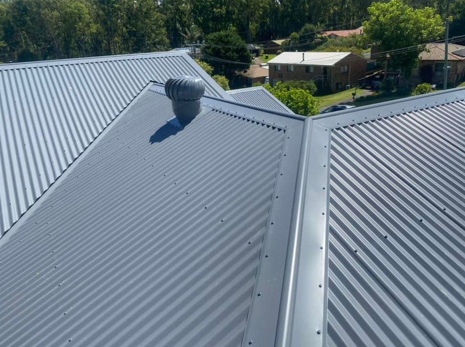 An Aerial View of a Metal Roof With a Chimney on Top of It — Ben McLennan Constructions in Grafton, NSW