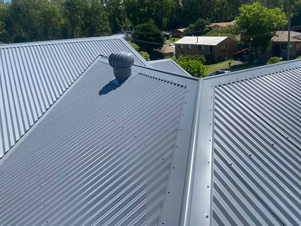 An Aerial View of a Metal Roof With a Vent on Top of It — Ben McLennan Constructions in Yamba, NSW