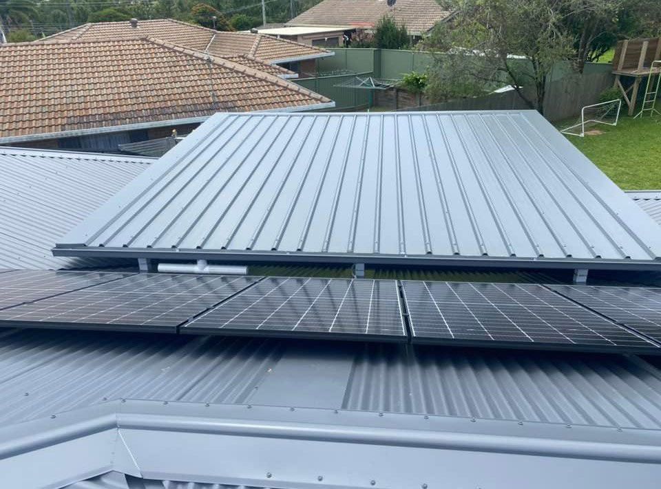 A Roof With a Lot of Solar Panels on It — Ben McLennan Constructions in Grafton, NSW