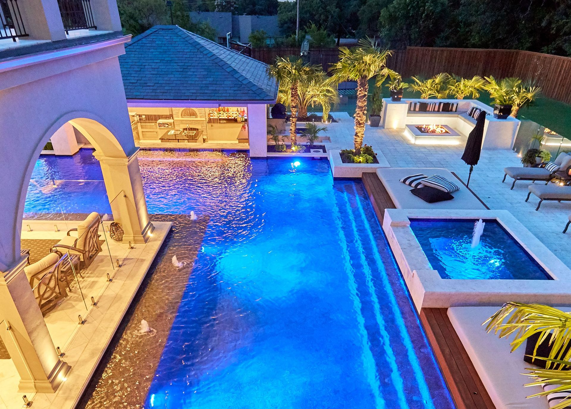 Custom pool illuminated at dusk