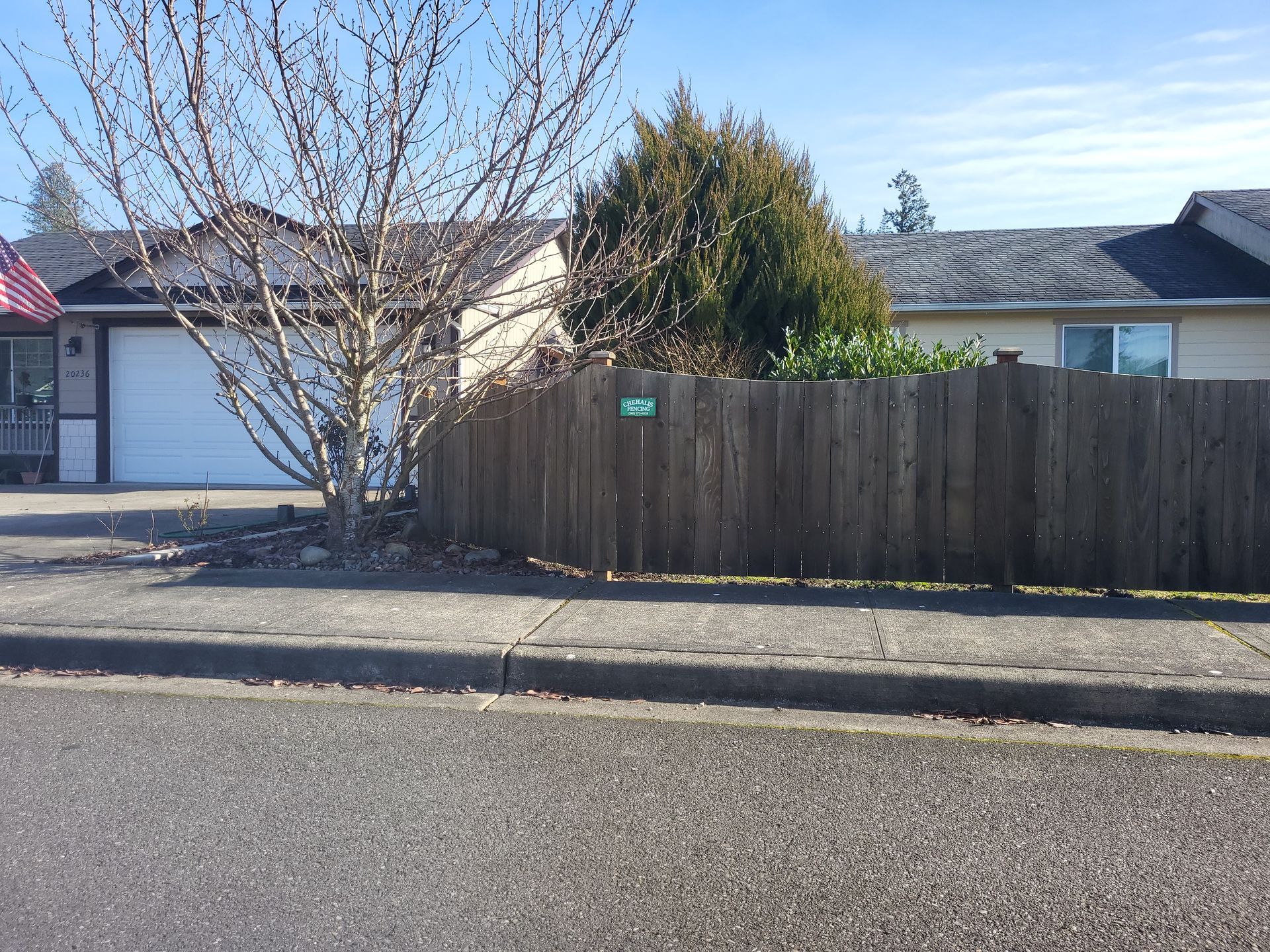 House With Wooden Fence — Rochester, WA — Chehalis Fencing Inc