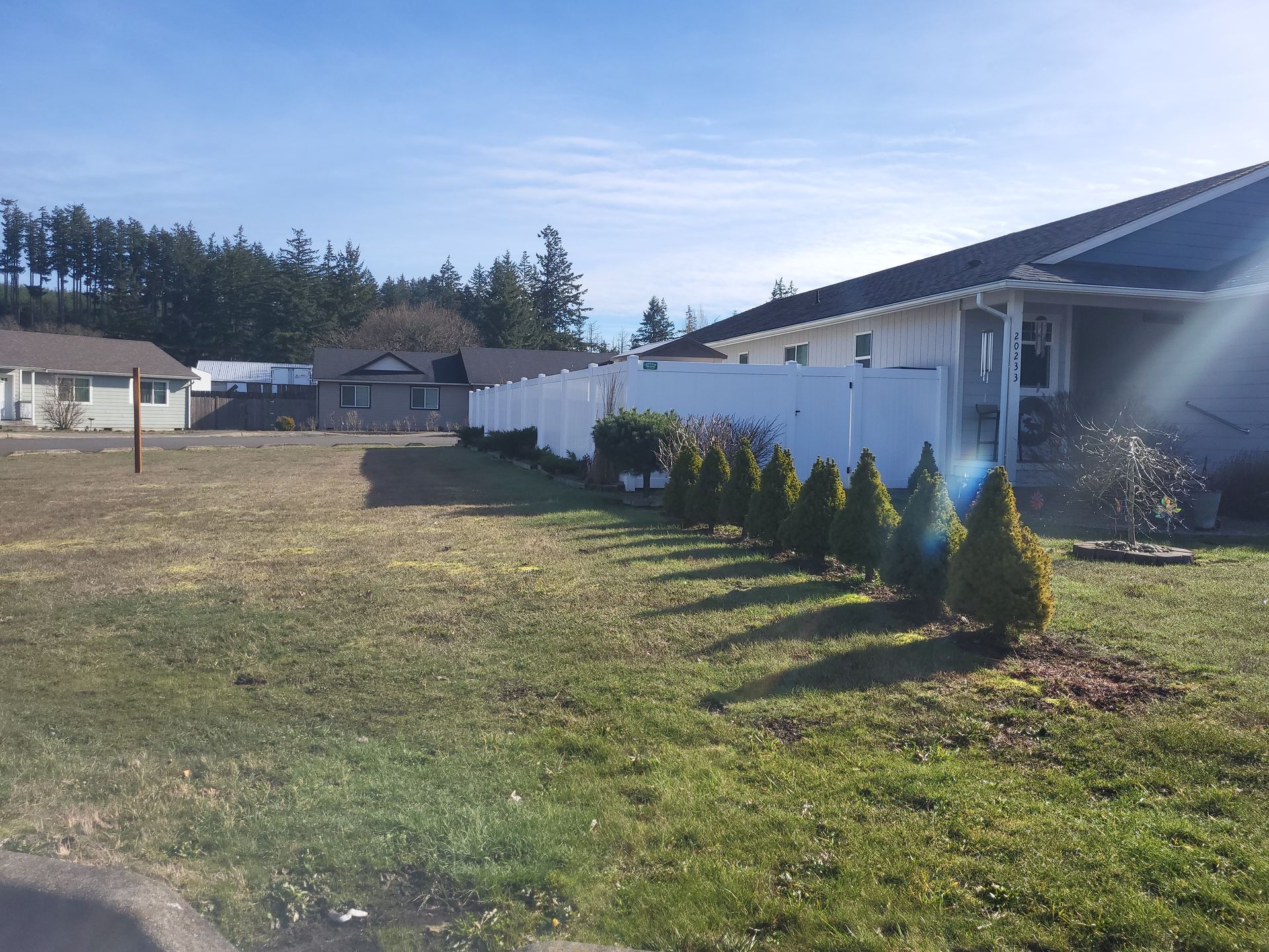 House With White Vinyl Fence — Rochester, WA — Chehalis Fencing Inc