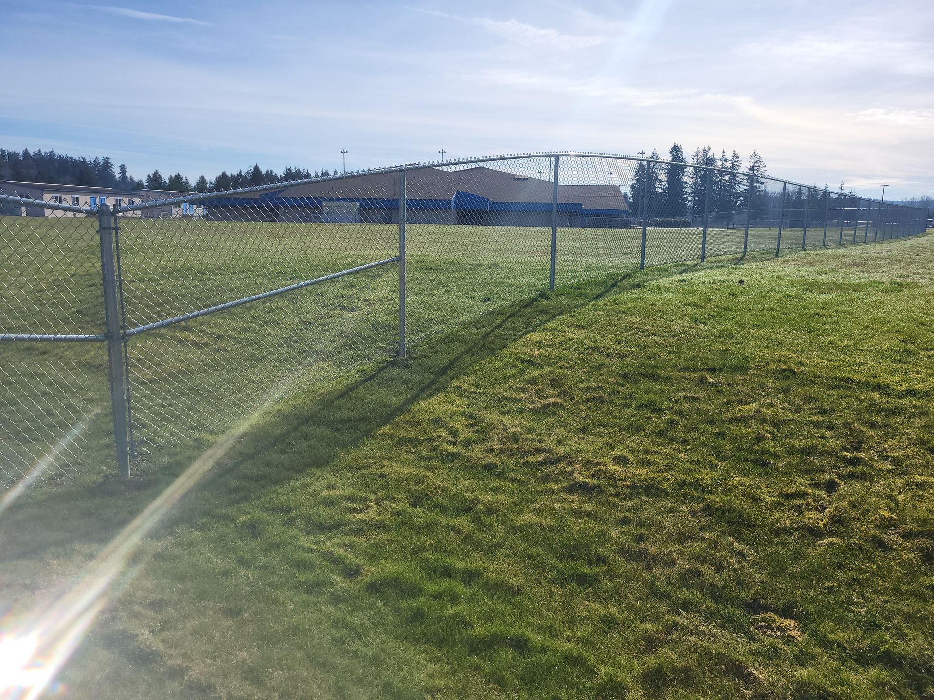 Field With Security Fence — Rochester, WA — Chehalis Fencing Inc