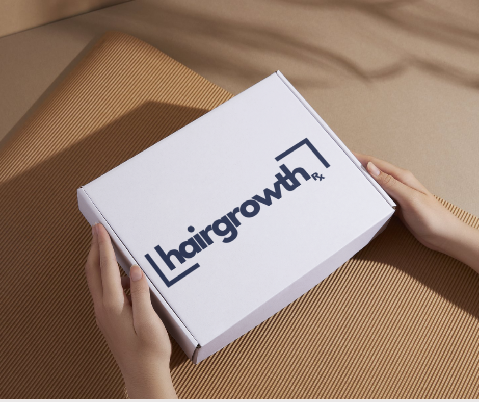 Hands holding a white box with 