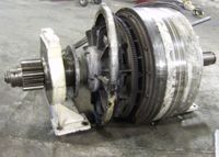 A large metal object is sitting on top of a concrete floor.