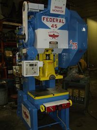 A blue and yellow machine that says federal 45 on it