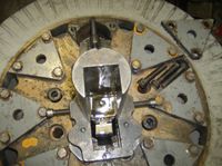 A close up of a metal object with holes in it.