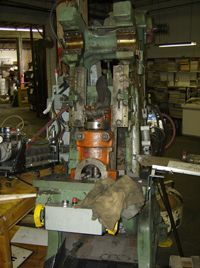 A machine is sitting on a table in a factory.