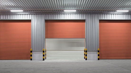 Commercial Garage Door  — Roller Door Outside of Factory Building in Birmingham, AL