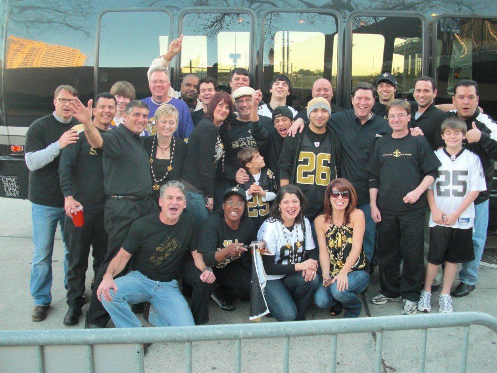 A group of people posing for a picture with one wearing a number 25 jersey