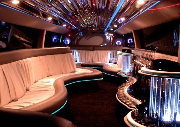 The inside of a limousine with a lot of lights on the ceiling