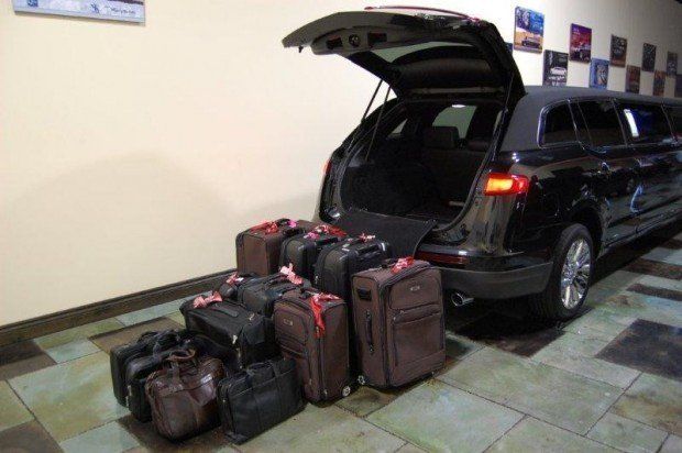 The trunk of a car is full of luggage