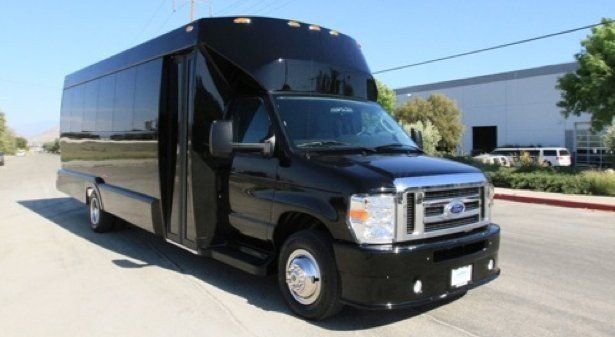 A black van is parked on the side of the road.