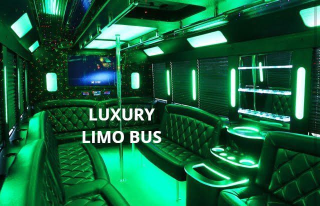 The inside of a luxury limo bus with green lights