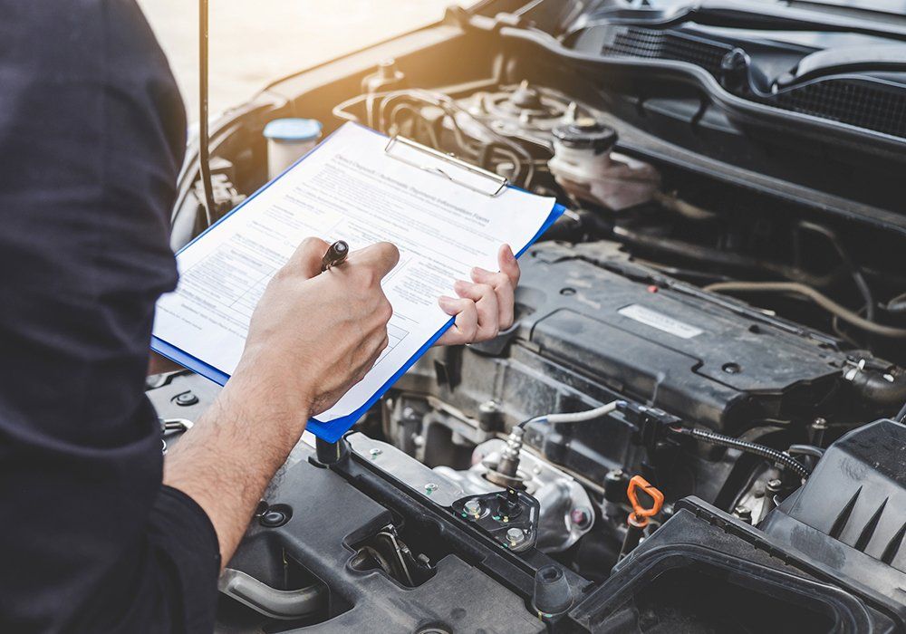 Person Doing Car Inspection — Hagerstown, MD — Guaranteed Truck & Auto Repair