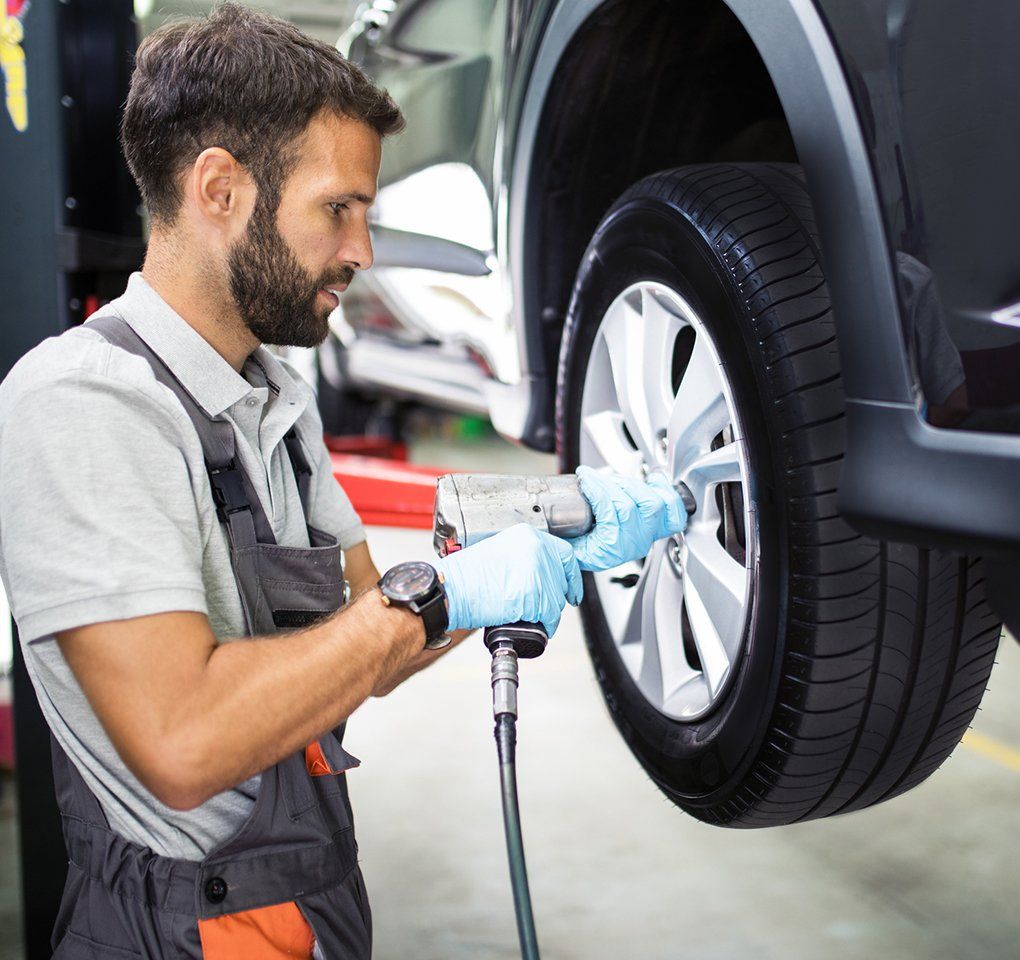 Mechanic Fixing The Tire Rotation — Hagerstown, MD — Guaranteed Truck & Auto Repair